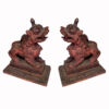 Leones tibetanos de madera tallada